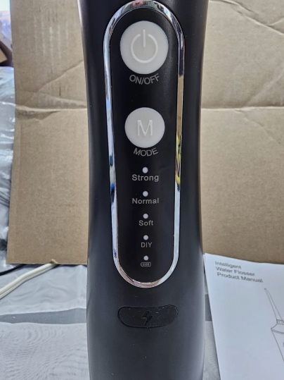 Close-up of cordless water flosser controls