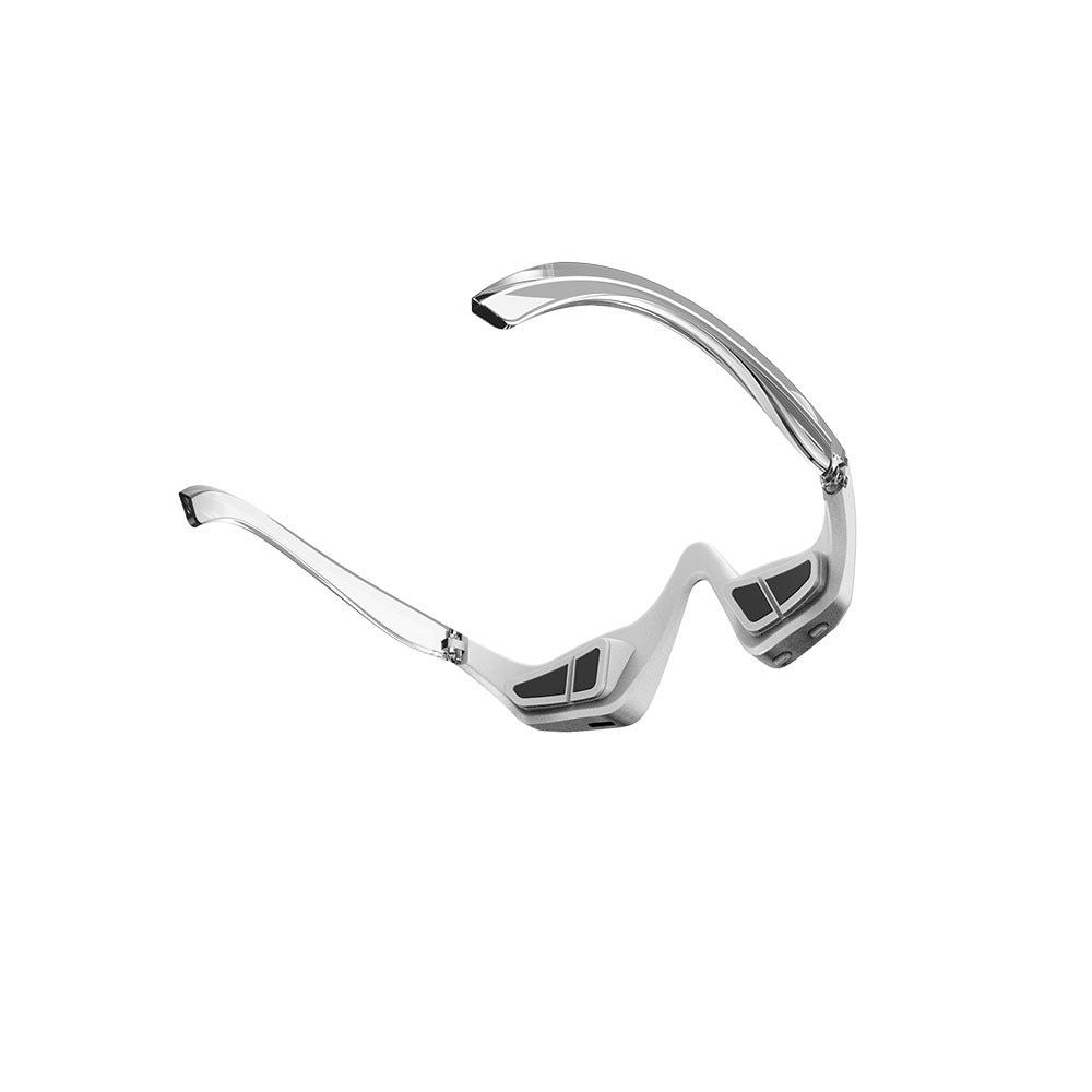 Under-eye red light massager worn hands-free over closed eyes