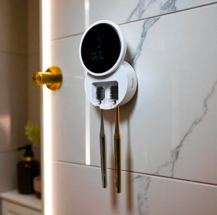UV toothbrush sanitizer mounted on a bathroom wall